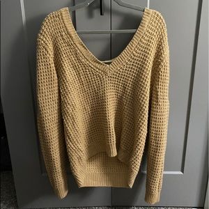 V-neck sweater with an open back